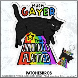 May include: Embroidered patch featuring a black cat with the text "MUCH GAYER THAN ORIGINALLY PLANNED" in rainbow colors. A matching keychain is also visible. The patch is from the brand PATCHESBROS.