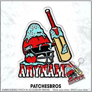 May include: An embroidered patch featuring a red cricket helmet and a wooden cricket bat covered in light blue icing with red sprinkles. The word ANYNAME is written in bold red letters at the bottom. A matching keychain is shown in the corner.