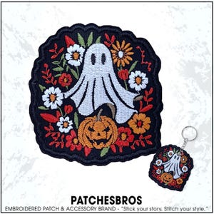 May include: Embroidered patch and keychain featuring a white ghost, orange jack-o'-lantern, and colorful flowers on a black background. The patch has a scalloped edge. The text "PATCHESBROS" is at the bottom.