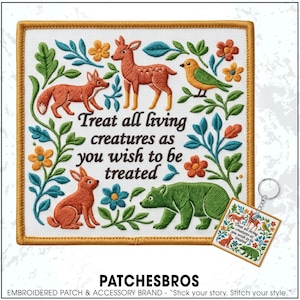 May include: Embroidered patch with a gold border featuring a fox, deer, bird, rabbit, and bear, surrounded by floral elements. The text reads, "Treat all living creatures as you wish to be treated." A matching keychain is also visible.