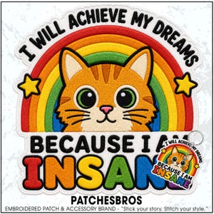 May include: An embroidered patch featuring an orange tabby cat face centered in front of a rainbow and two yellow stars. The text reads I WILL ACHIEVE MY DREAMS BECAUSE I AM INSANE. A smaller version of the patch is attached to a metal keychain ring.