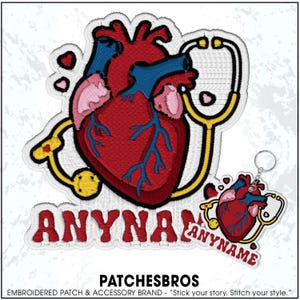May include: Embroidered patch featuring a stylized anatomical heart in red, blue, and pink, with a yellow stethoscope. The word "ANYNAME" is embroidered in red. A keychain with a similar design is also present.