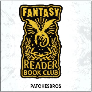 May include: Embroidered patch with a black background and gold-colored text and design. The patch reads "FANTASY READER BOOK CLUB" with a dragon illustration. The brand name "PATCHESBROS" is at the bottom.