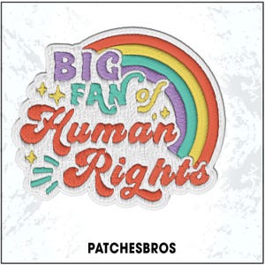 May include: Embroidered patch with the text "BIG FAN of Human Rights" in a colorful design. The patch features a rainbow, stars, and the brand name "PATCHESBROS" at the bottom. The patch is white with a textured background.