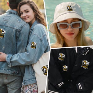 May include: A collection of apparel and accessories featuring a shield-shaped patch with a yellow excavator graphic and the text ANYNAME ANYTEXT. Items include a denim jacket, a white tote bag, a white bucket hat, and a black varsity jacket.