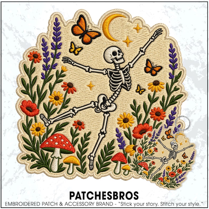 May include: An embroidered patch and matching keyring featuring a dancing skeleton surrounded by colourful wildflowers, red and yellow mushrooms, orange butterflies, and a yellow crescent moon against a light beige background with green foliage.