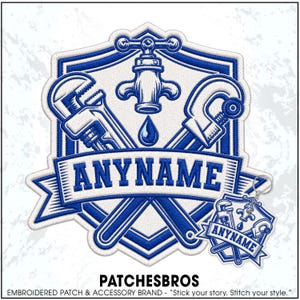 May include: A blue and white embroidered patch and matching keychain featuring a shield design with a central water faucet, a single water droplet, and crossed plumbing tools. The word ANYNAME is stitched in blue on a banner across the center.