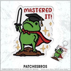 May include: Embroidered patch featuring a green frog wearing a graduation cap, red cape, and holding a sword. The text "MASTERED IT!" is above the frog. A matching keychain is also visible. The brand name "PATCHESBROS" is at the bottom.