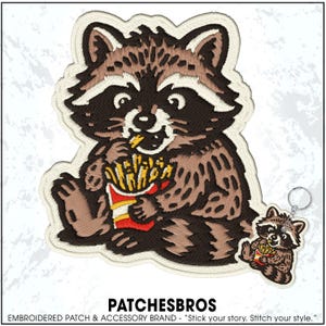 May include: Embroidered patch featuring a cartoon raccoon eating french fries from a red and yellow container. The raccoon is brown and white with a black mask. A matching keychain is also shown. The text "PATCHESBROS" is at the bottom.