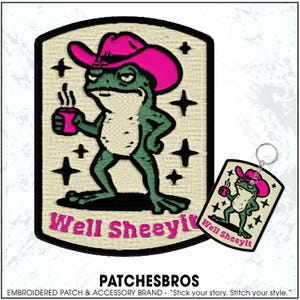 May include: Embroidered patch and keychain set featuring a green frog wearing a pink cowboy hat, holding a mug. The patch and keychain have the text "Well Sheeyit" in pink. The brand name "PATCHESBROS" is at the bottom.