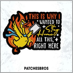 May include: Embroidered patch featuring a yellow duck engulfed in flames, holding a tablet. Text reads "THIS IS WHY I WANTED TO Stay Home ALL THIS RIGHT HERE." The patch has a black border and is from PatchesBros.