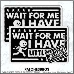May include: Black and white embroidered patches with the text "WAIT FOR ME I HAVE LITTLE LEGS". One patch has a running figure. A keychain with the same design is also shown. The patches have a white border and star accents.