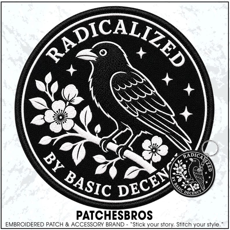 May include: A circular black and white embroidered patch and a matching circular keychain. Both feature a crow perched on a flowering branch with the text RADICALIZED BY BASIC DECENCY in a circular border and four-pointed stars in the background.