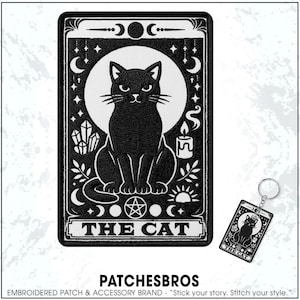 May include: Black embroidered patch featuring a black cat tarot card design. The patch includes a white moon, stars, and the text "THE CAT". A matching keychain is also visible. The brand name "PATCHESBROS" is at the bottom.