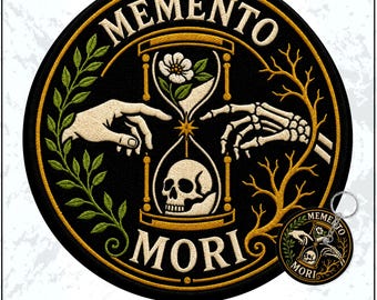 May include: A circular embroidered patch and a matching keychain featuring the text MEMENTO MORI. The design displays a central hourglass containing a white flower and a skull, flanked by a human hand and a skeleton hand, with green leaves and gold branches.