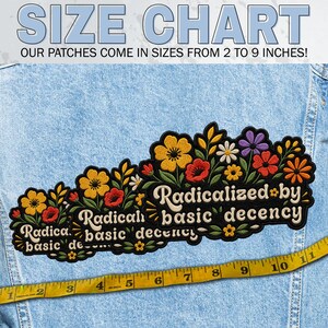 May include: An embroidered patch featuring a floral arrangement with yellow, red, orange, and purple flowers and green leaves. The text reads "Radicalized by basic decency" in a cream-colored font. A yellow measuring tape shows sizes from 2 to 9 inches.