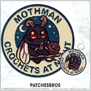 May include: Embroidered patch and keychain set featuring a cartoon Mothman crocheting. The patch is circular with the text "Mothman Crochets at Night." The Mothman is purple with red eyes, holding yarn. The keychain mirrors the patch design.