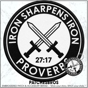 May include: A circular embroidered patch and a matching circular keychain featuring a black border with the white text IRON SHARPENS IRON PROVERBS 27:17. The center displays two crossed swords in white with black outlines on a white background.