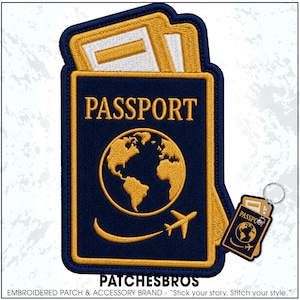 May include: A dark blue embroidered patch shaped like a passport with gold borders, featuring the word PASSPORT, a gold globe, and a small airplane icon. Two white document inserts are visible at the top. A matching passport keychain is included.