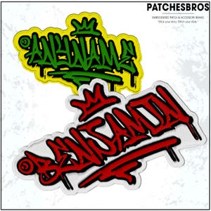May include: Two embroidered patches with graffiti-style lettering. One patch features green text on a yellow background, the other has red text on a white background. The patches are from the brand PATCHESBROS.