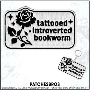 May include: Embroidered patch and keychain set featuring a black rose and the words "tattooed + introverted bookworm." The patch is rectangular with rounded corners and a white border. The keychain mirrors the patch design.