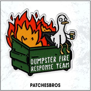May include: Embroidered patch featuring a green dumpster engulfed in orange and yellow flames. A white bird with a cup sits on the dumpster. Text reads "DUMPSTER FIRE RESPONSE TEAM" and "PATCHESBROS".