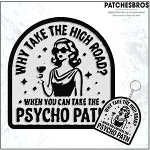 May include: A black and white embroidered patch and keychain set. The patch and keychain feature a retro woman holding a drink, with the text "WHY TAKE THE HIGH ROAD? WHEN YOU CAN TAKE THE PSYCHO PATH". The brand name "PATCHESBROS" is at the top.