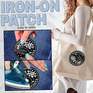 May include: A circular iron-on patch featuring a black and white graphic of a bird perched on a flowering branch with the text "RADICALIZED BY BASIC DECENCY" in a circular border. The patch is shown being applied to denim fabric with an iron.