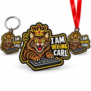 May include: A keychain, a patch, and an ornament featuring an embroidered brown tabby cat wearing a gold crown, typing on a keyboard with its mouth open, and the text I AM YELLING CARL in yellow and white letters on a black background.