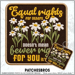 May include: A square embroidered patch and a matching square keychain featuring a dark brown background with white daisy flowers and yellow and green text that reads Equal rights for others doesn't mean fewer rights for you it's not pie.