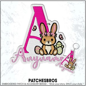 May include: Embroidered patch featuring a pink letter "A" with a bunny and chick design. The patch includes the name "Anya" in a cursive font. A matching keychain with the same design is also visible. The brand name "PATCHESBROS" is at the bottom.