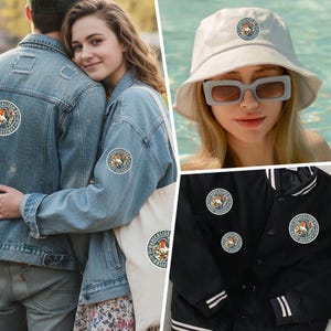 May include: A collection of apparel and accessories featuring a circular patch with a bird illustration and the text "RADICALIZED BY BASIC DECENCY". Items include a light blue denim jacket, a white bucket hat, a tote bag, and a black varsity jacket.