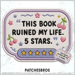 May include: A rectangular embroidered patch with rounded corners featuring the black text THIS BOOK RUINED MY LIFE. 5 STARS. surrounded by pink cherries, a pink heart, a pink flower, and blue stars. A row of five yellow stars is at the bottom.