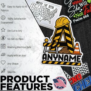 May include: An embroidered patch featuring a yellow construction hard hat atop a large letter A with black and yellow hazard stripes, a construction barrier, a traffic cone, and a pile of dirt, with the text ANYNAME printed in black block letters.