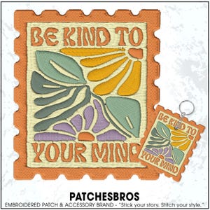 May include: Embroidered patch and keychain featuring a floral design with the text "BE KIND TO YOUR MIND." The patch and keychain have an orange border and a cream-colored background. The floral design includes yellow, green, and purple elements.