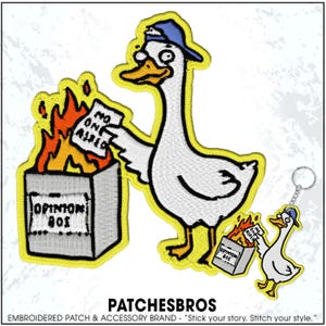May include: Embroidered patch featuring a white goose wearing a blue cap, placing a paper labeled "NO ONE ASKED" into a burning "OPINION BOX". A keychain with a similar design is also shown. The patch has a yellow border.