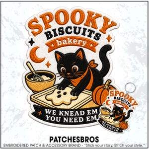 May include: An embroidered patch and matching keychain featuring a black cat wearing an orange bandana, baking a ghost-shaped cookie on a tray. The design includes a mixing bowl, a pumpkin, and the text SPOOKY BISCUITS BAKERY and WE KNEAD EM YOU NEED EM.