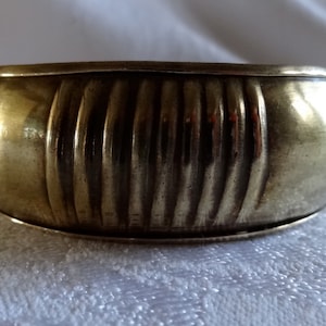 Chunky brass bangle bracelet with ribbed pattern
