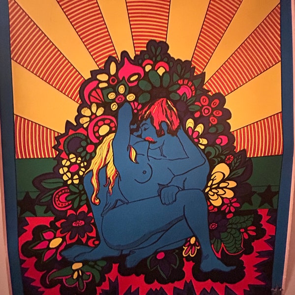 Vintage blacklight poster featuring a blue couple of lovers surrounded by flowers and bright sun rays