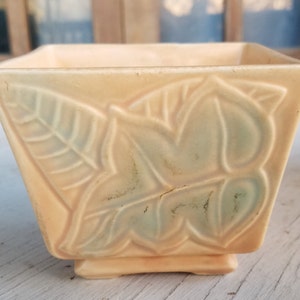 Vintage pretty square, footed pottery dish with leaf motifs