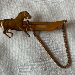 Vintage gold tone tie clip with horse signed Anson