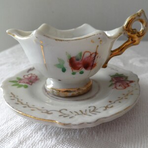 Vintage miniature china cup and saucer with red flowers and gilt accents Occupied Japan