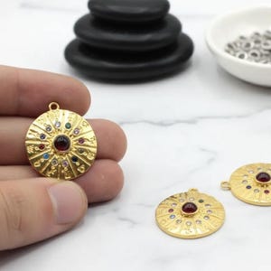 May include: A set of three ceramic mugs with a speckled, matte finish. The mugs are in shades of cream, light brown, and dark brown. Each mug has a simple, minimalist design and a rounded handle.