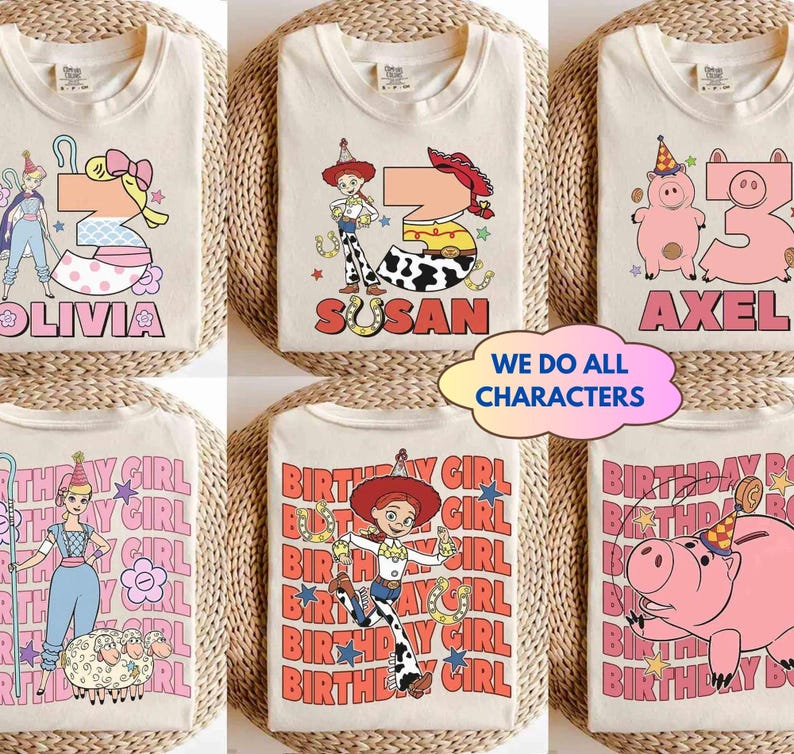 May include: Cream-colored t-shirts with colorful cartoon graphics and names. Designs include a princess, a cowgirl, and a pig, with the names "Olivia", "Susan", and "Axel". The text "We Do All Characters" is also visible.