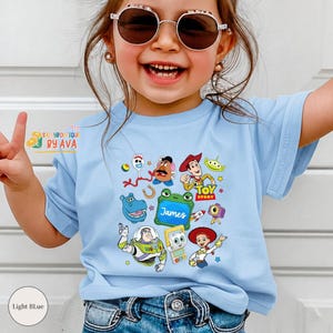 Custom Name Toy Story 5 Movie Shirt, Lilypad Buzz Lightyear Woody Jessie Toy Story Land You've Got a Friend In Me Adult & Kids Shirt image 1