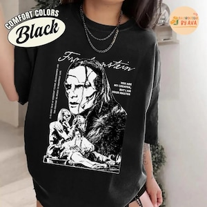 May include: Black comfort colors t-shirt featuring a black and white graphic of Frankenstein with the text "Frankenstein" and "You are my creator, but I am your master." The shirt also has the text "A classic tale of scientist Victor Frankenstein and the creature he brings to monstrous life."