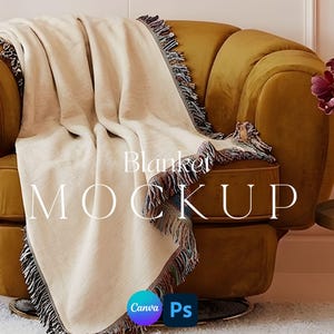 May include: A cream blanket with fringed edges is draped over a mustard-yellow armchair. The blanket has a woven texture and is labelled "Blanket MOCKUP" in white text. The Canva and Ps logos are visible.