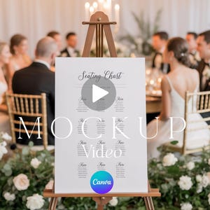 May include: A white seating chart on an easel, with the words "Seating Chart" at the top. The word "MOCKUP Video" is overlaid on the image. The Canva logo is in the bottom right corner. The background shows a wedding reception.