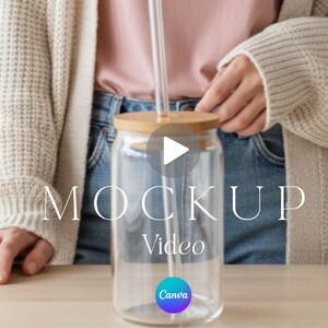 May include: A clear glass tumbler with a cylindrical shape, featuring a light-colored bamboo lid and a transparent straw inserted through the center. The glass is empty and smooth, positioned upright on a flat surface. The text MOCKUP Video is visible.