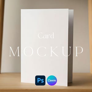 May include: A white card mockup with the text "Card MOCKUP" in a serif font. The card is standing on a wooden shelf. The Photoshop and Canva logos are in the bottom right corner.